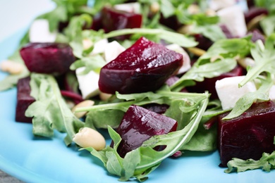 Fresh delicious beet salad on plate, closeup