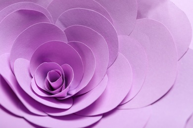 Photo of Beautiful violet flower made of paper as background, closeup