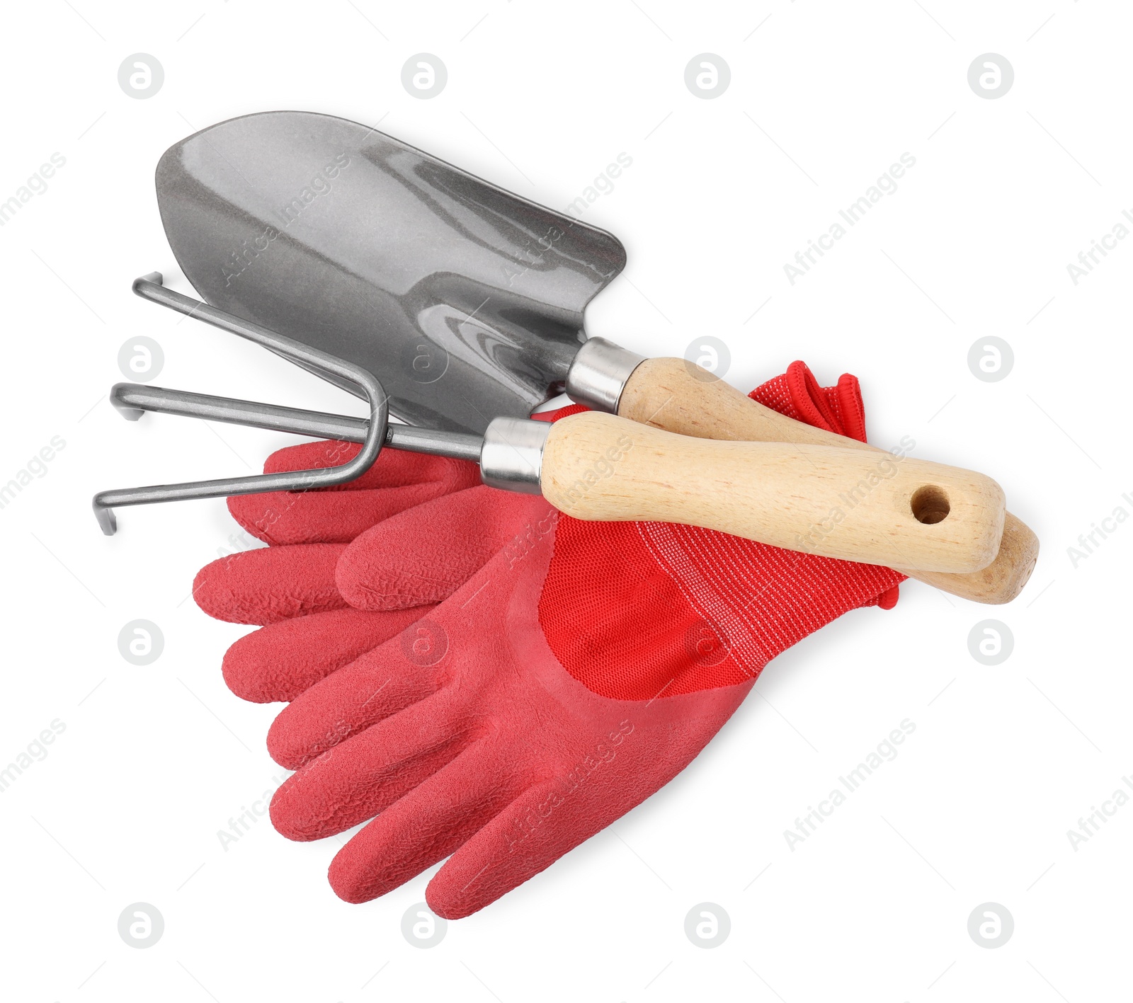 Photo of Gardening gloves, trowel and rake isolated on white, top view