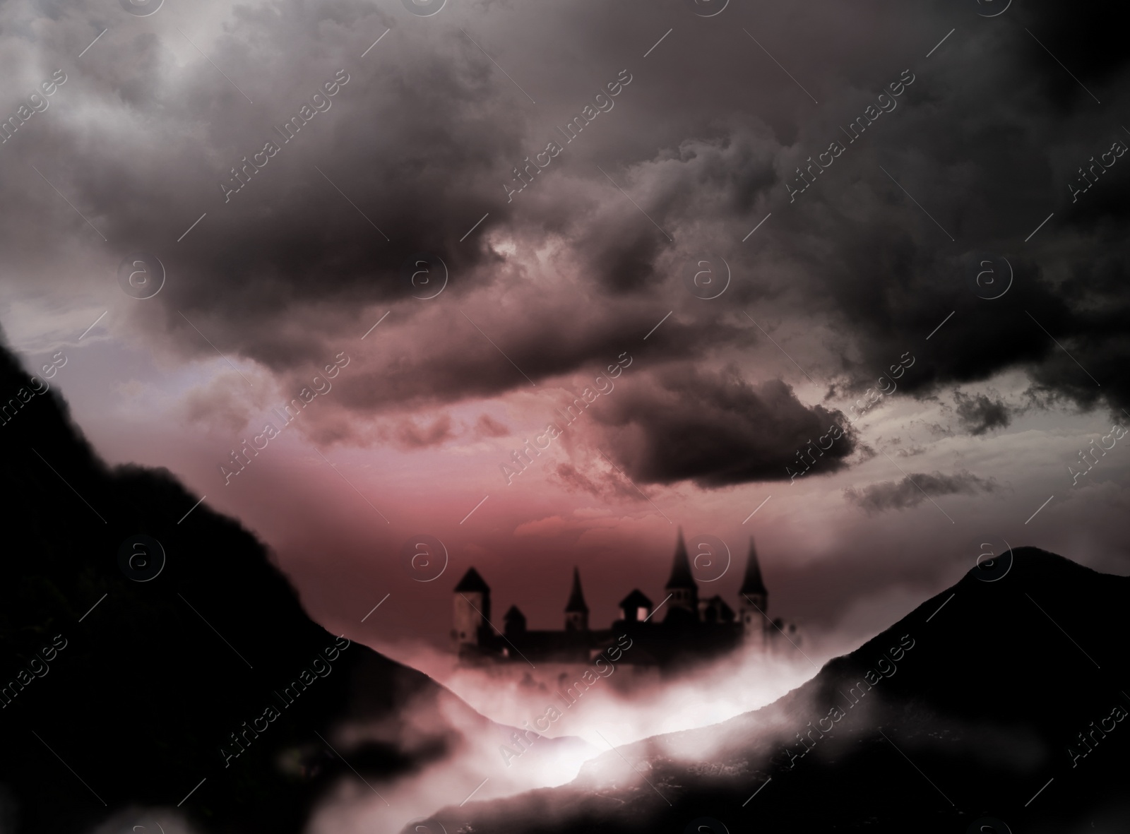 Image of Fantasy world. Mystical castle and mountains covering with fog in night