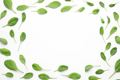 Photo of Frame of fresh green healthy spinach on white background, top view. Space for text