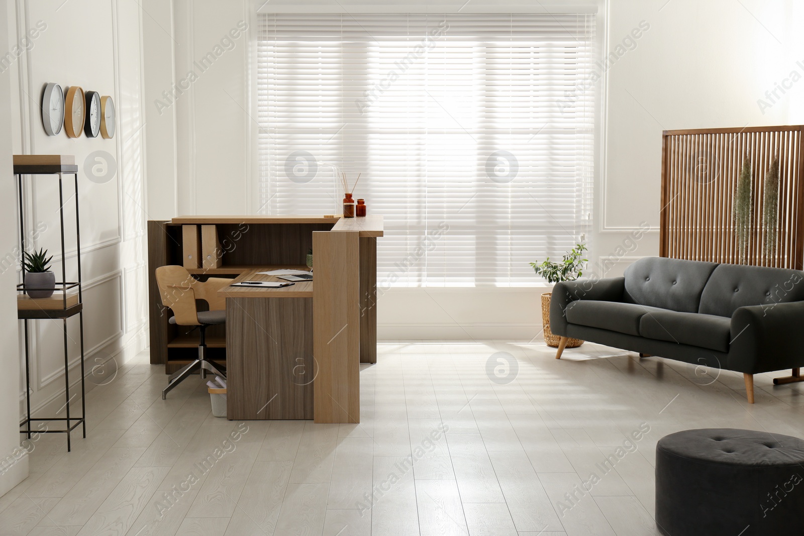 Photo of Hotel lobby interior with wooden reception desk. Stylish workplace