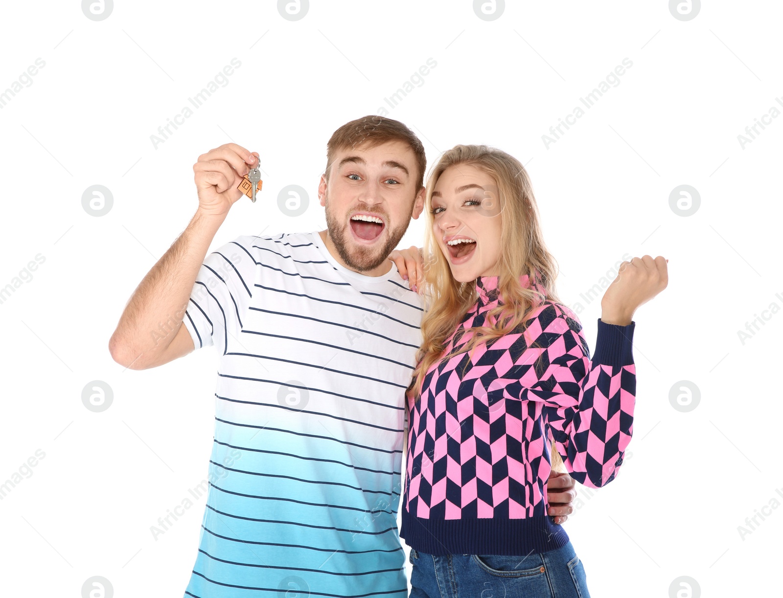 Photo of Happy young couple with house key on white background