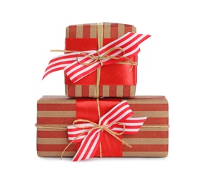 Photo of Christmas gift boxes decorated with bows on white background