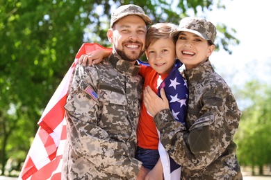 Happy military family with their son outdoors
