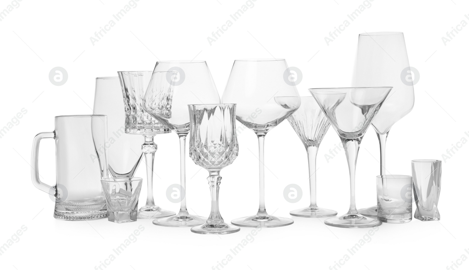 Photo of Different elegant empty glasses isolated on white