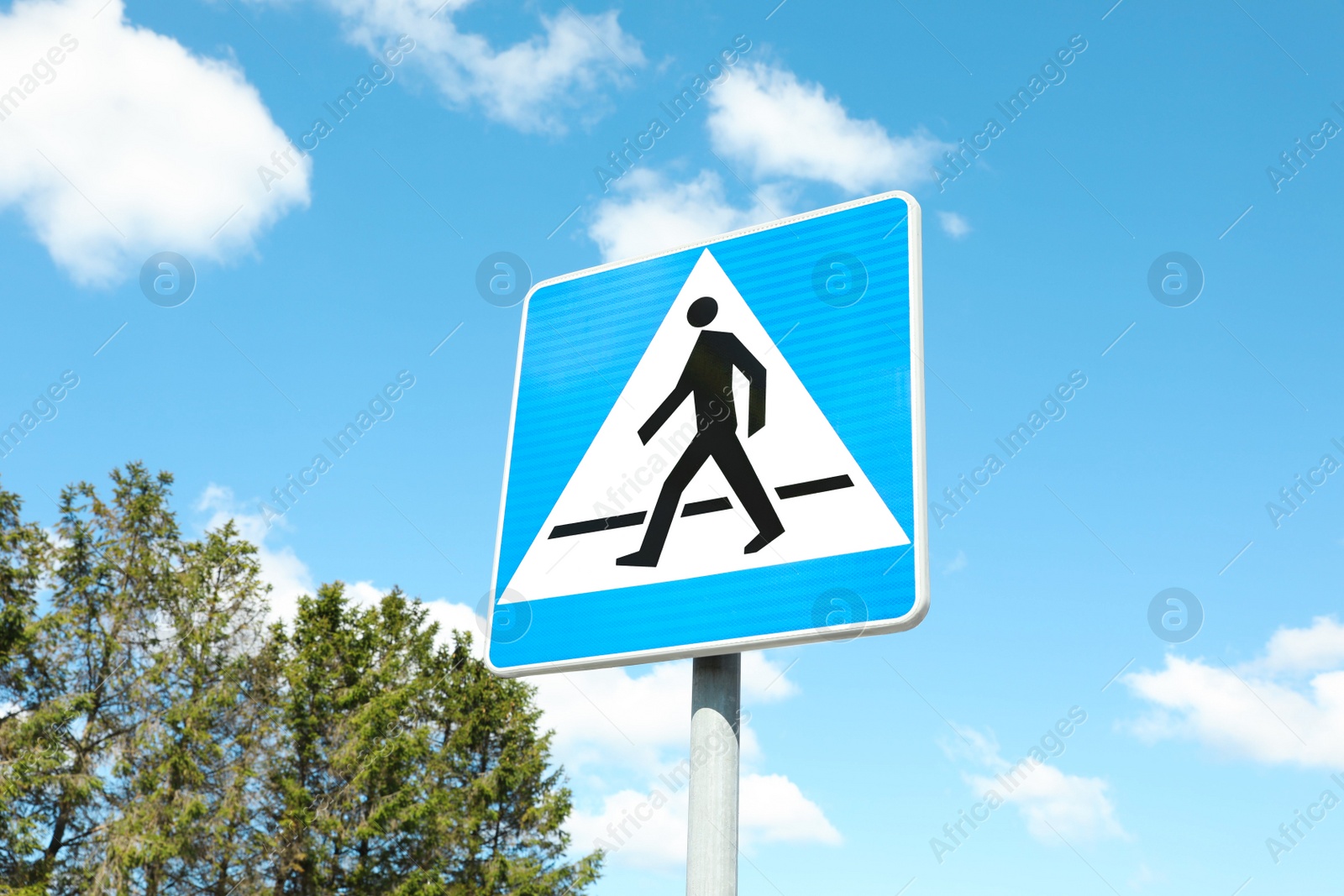 Photo of Traffic sign Pedestrian Crossing against blue sky, low angle view