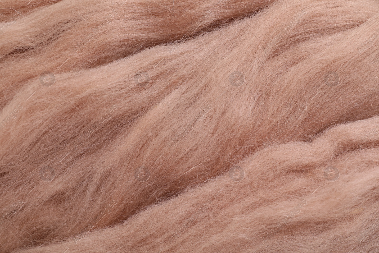 Photo of Soft felting wool as background, closeup view