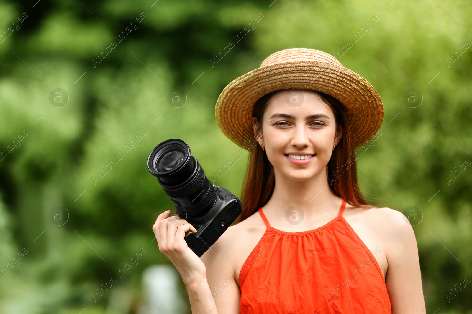 Photo of Photographer with professional camera in park. Space for text