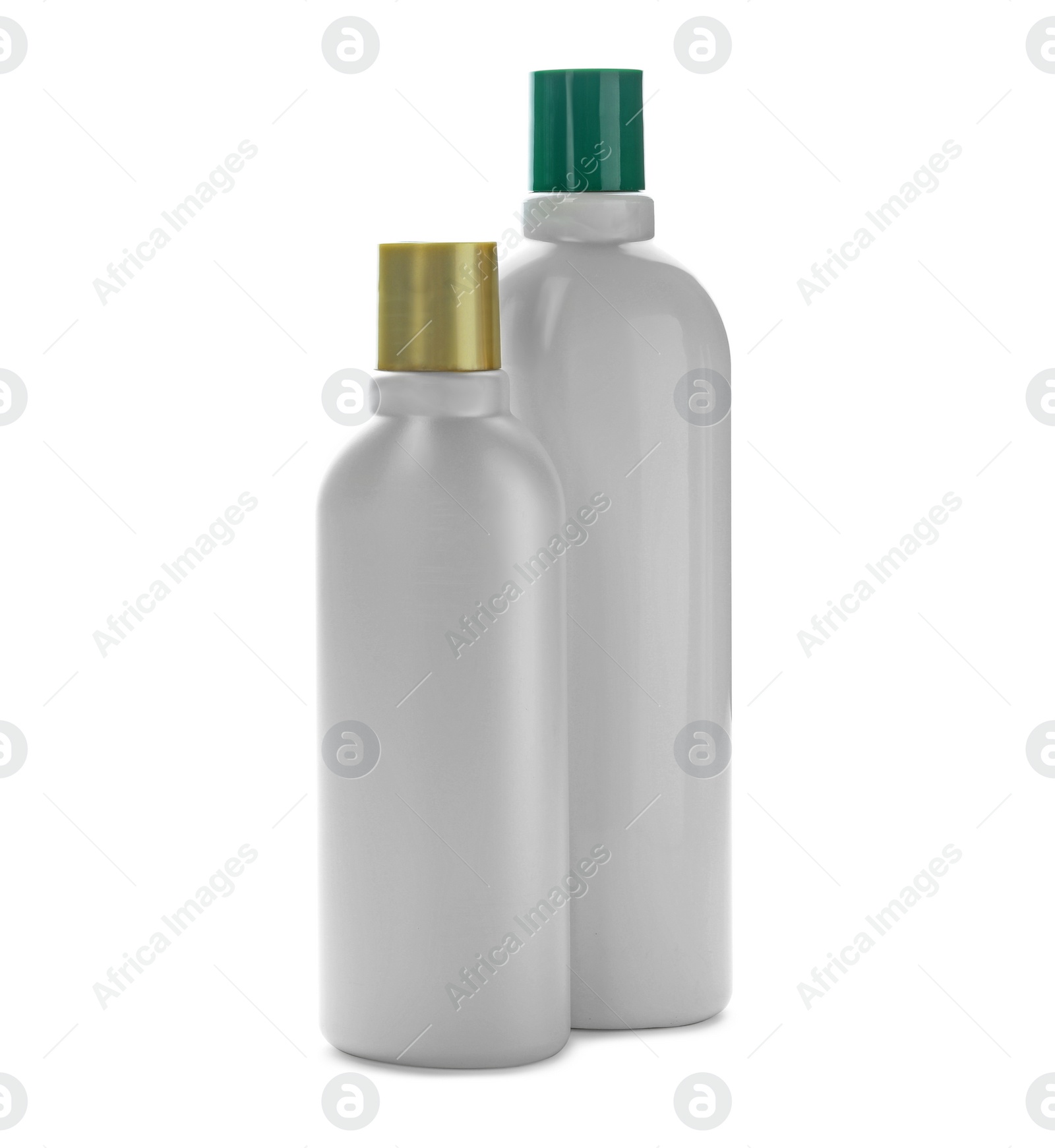 Photo of Bottles with cosmetic products on white background. Mockup for design