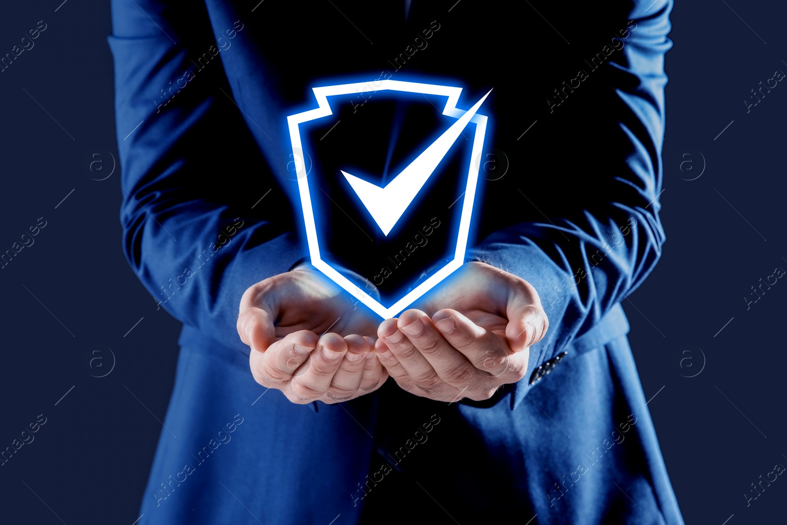 Image of Anti-fraud security system. Man with illustration of checkmark in shield on dark blue background, closeup