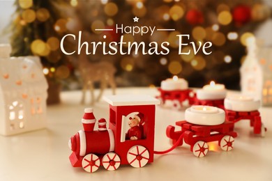 Image of Happy Christmas Eve, postcard design. Red toy train as candle holder on white table in room