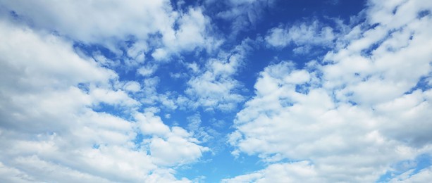 Image of Picturesque view of beautiful blue sky with white clouds on sunny day, banner design