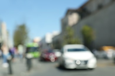 Blurred view of people on city street. Bokeh effect