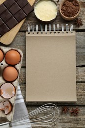 Photo of Blank recipe book and different ingredients on wooden table, flat lay. Space for text