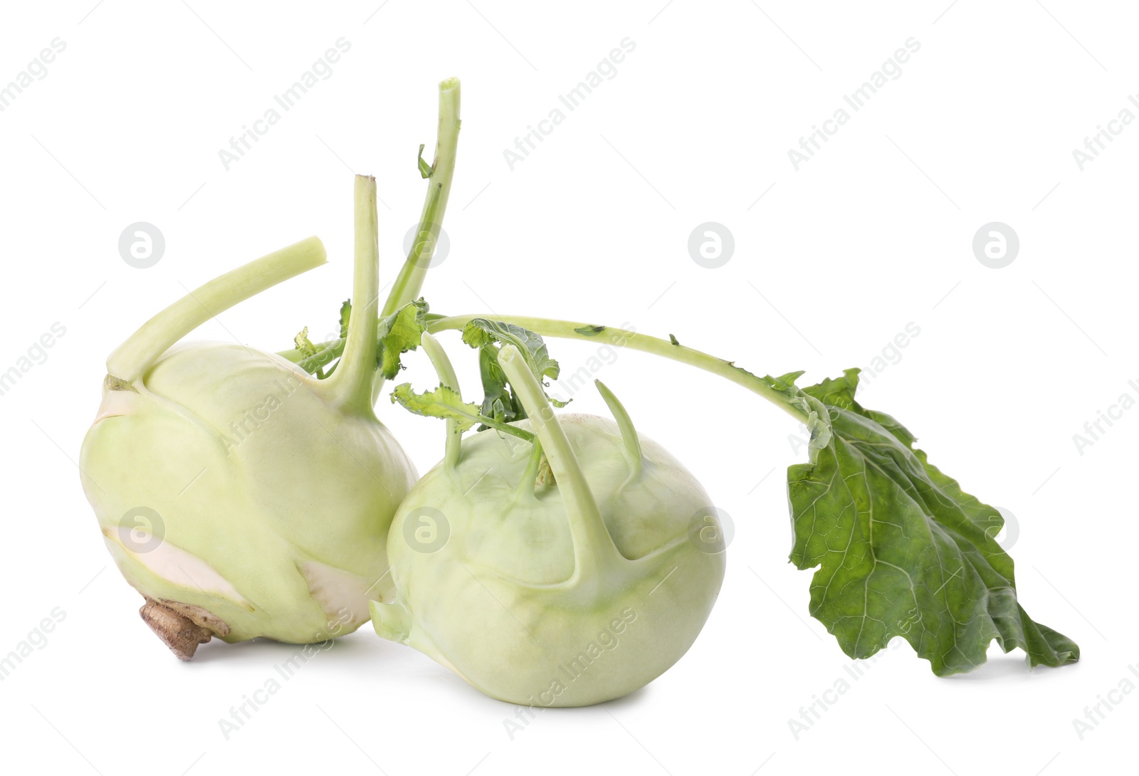 Photo of Whole ripe kohlrabies with leaves on white background