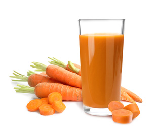 Image of Carrots and glass of fresh juice on white background