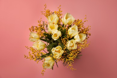 Photo of Bouquet with beautiful tulips and mimosa flowers on pink background, top view