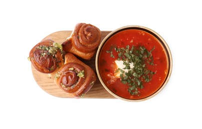 Photo of Tasty fresh pampushky and borsch. Traditional Ukrainian buns with garlic and beet soup isolated on white, top view