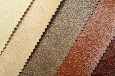 Texture of different natural leather as background, top view
