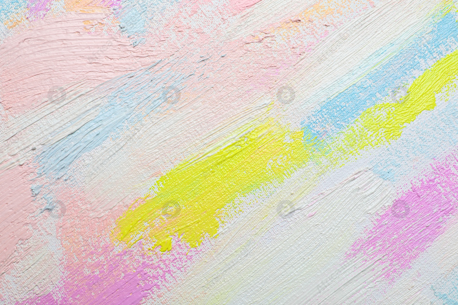 Photo of Strokes of different pastel acrylic paints on white canvas, closeup