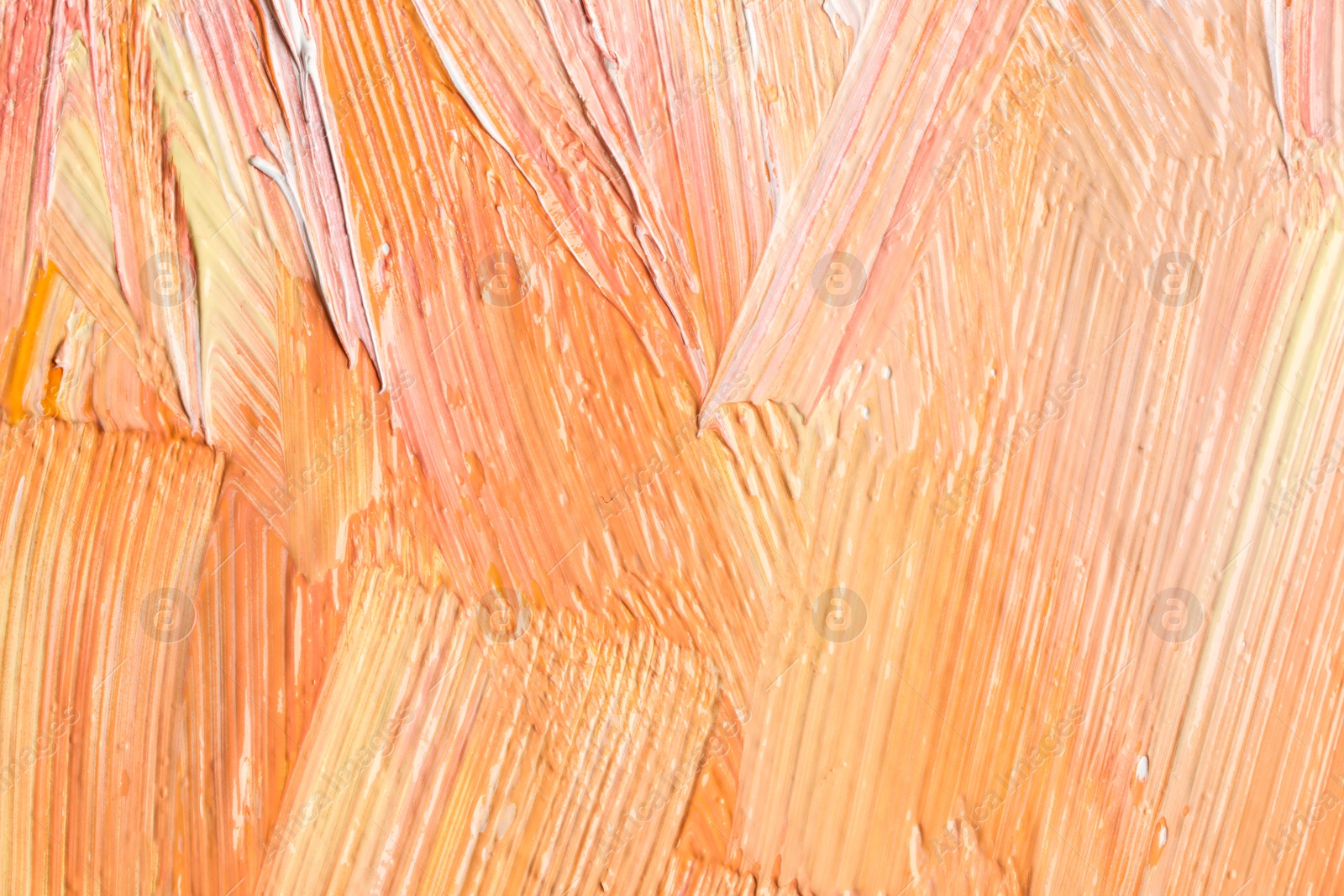 Photo of Beautiful strokes of colorful oil paints as background, closeup