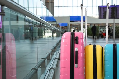 Image of Group of stylish suitcases in airport terminal