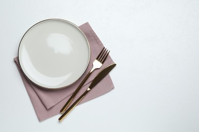 Beautiful table setting on white background, flat lay. Space for text