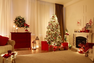 Living room with fireplace and Christmas decorations. Festive interior design