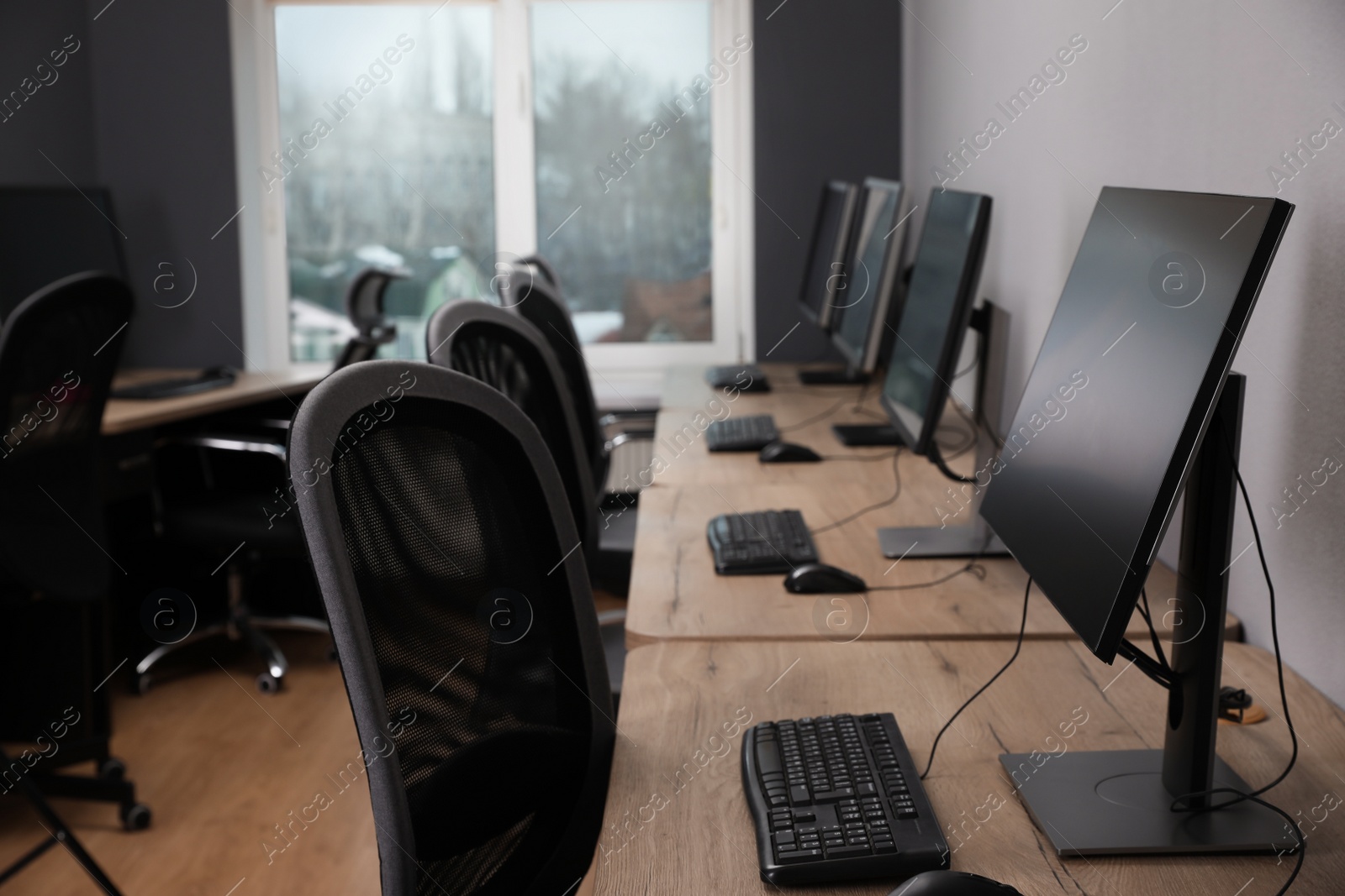 Photo of Many modern computers in open space office