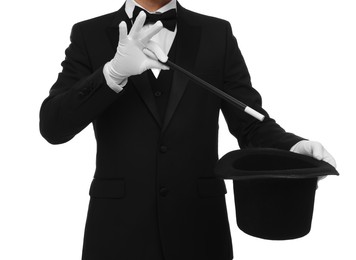 Photo of Magician showing magic trick with top hat on white background, closeup