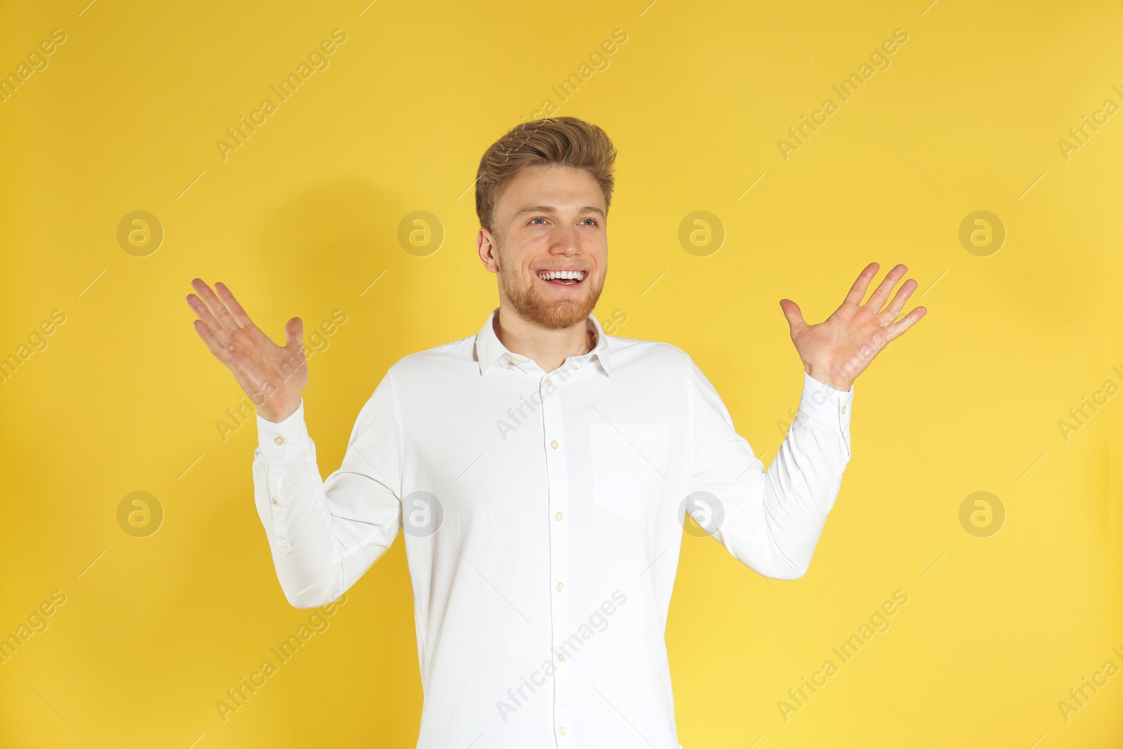 Photo of Portrait of handsome emotional man on color background