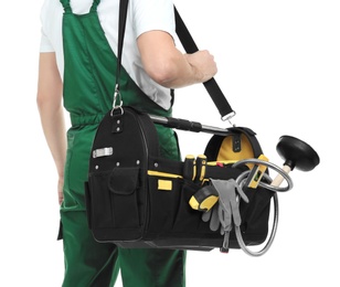 Photo of Young plumber with tool bag on white background, closeup