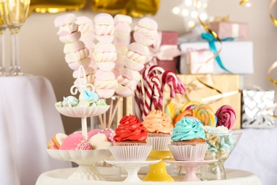 Photo of Candy bar with delicious treats for birthday party