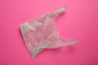 One plastic bag on pink background, top view