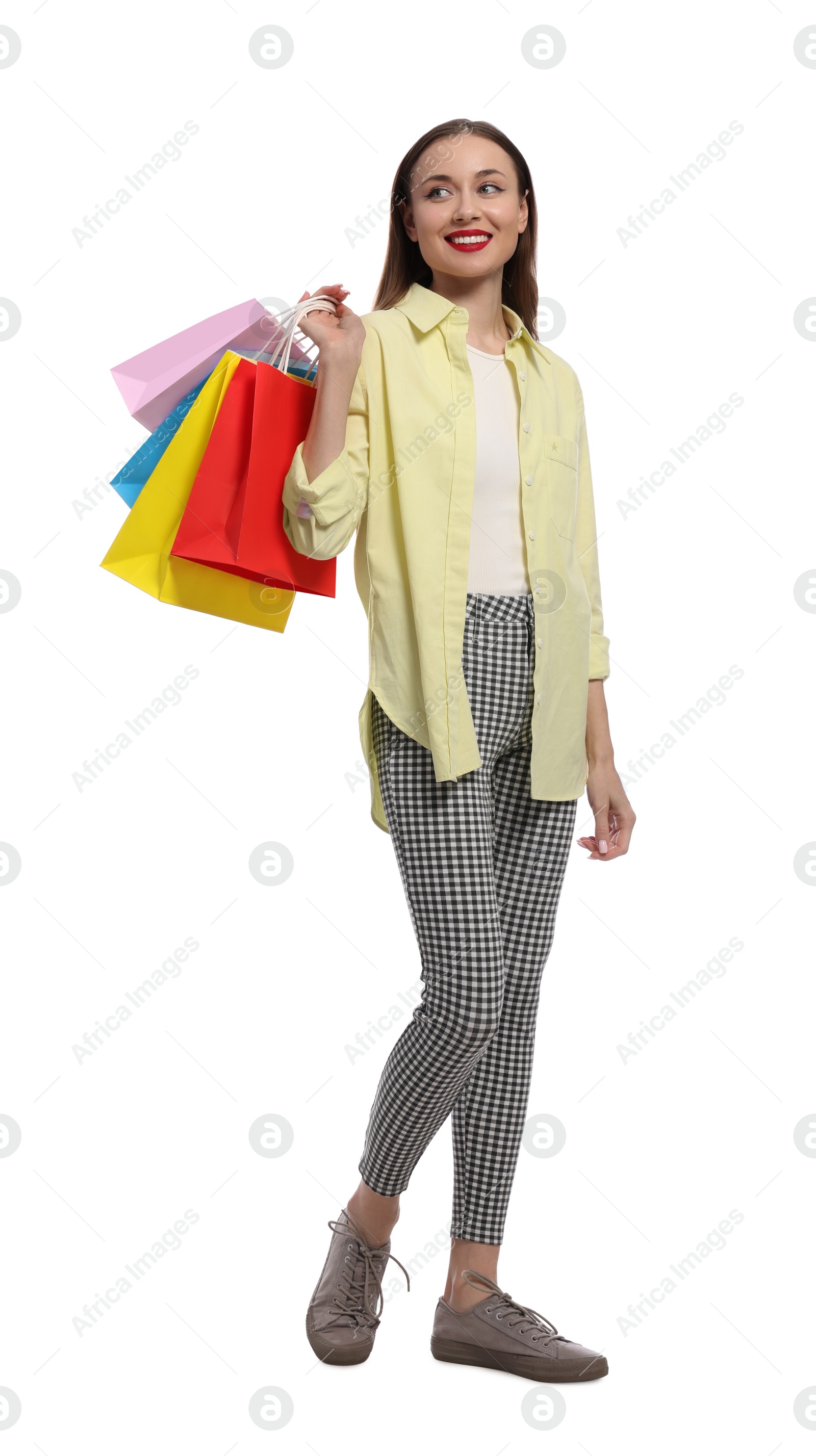 Photo of Stylish young woman with shopping bags on white background