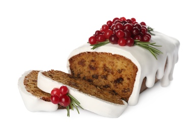Traditional Christmas cake with cranberries and icing isolated on white. Classic recipe
