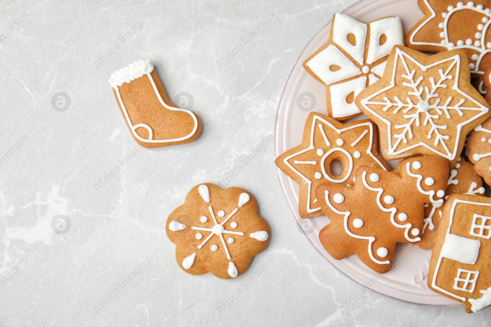 Photo of Plate with tasty homemade Christmas cookies on table, top view