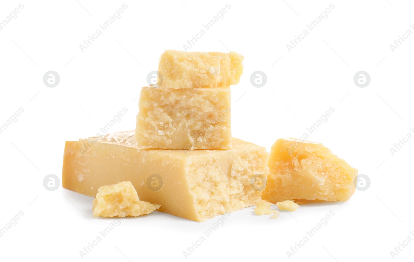 Photo of Pieces of delicious parmesan cheese on white background