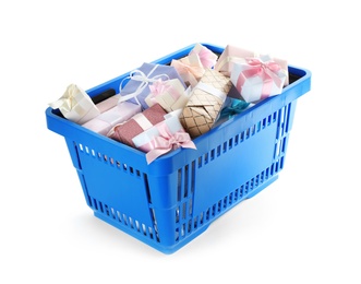 Photo of Blue shopping basket with different gifts on white background