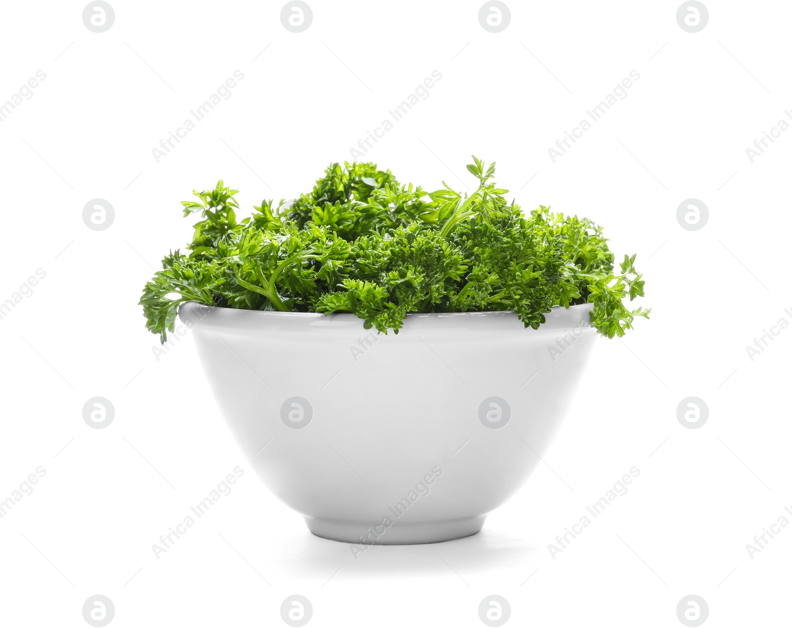 Photo of Bowl with fresh green parsley on white background