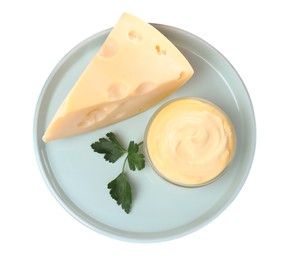 Photo of Tasty cheese, sauce and parsley on white background, top view