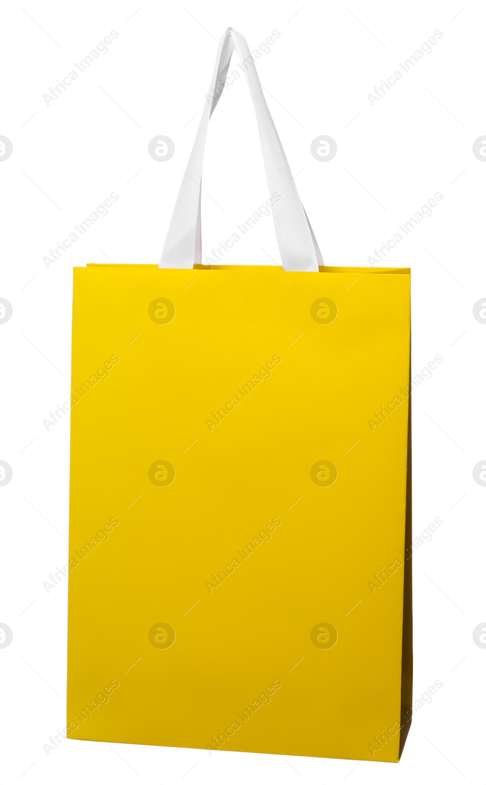 Photo of One yellow shopping bag isolated on white