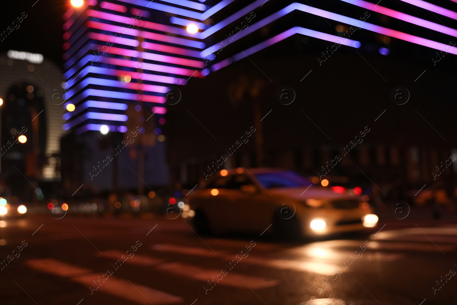 Photo of Blurred view of cityscape with bokeh effect. Night life