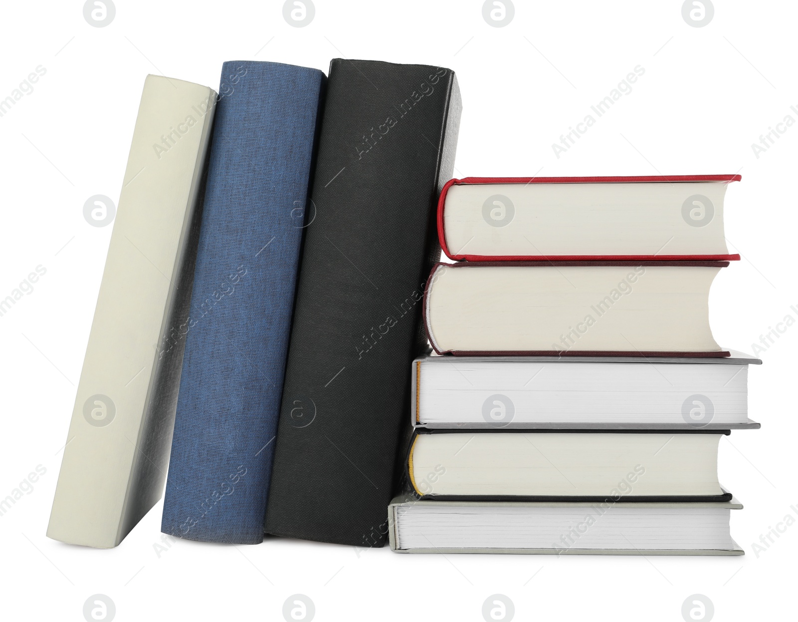 Photo of Many different books stacked on white background