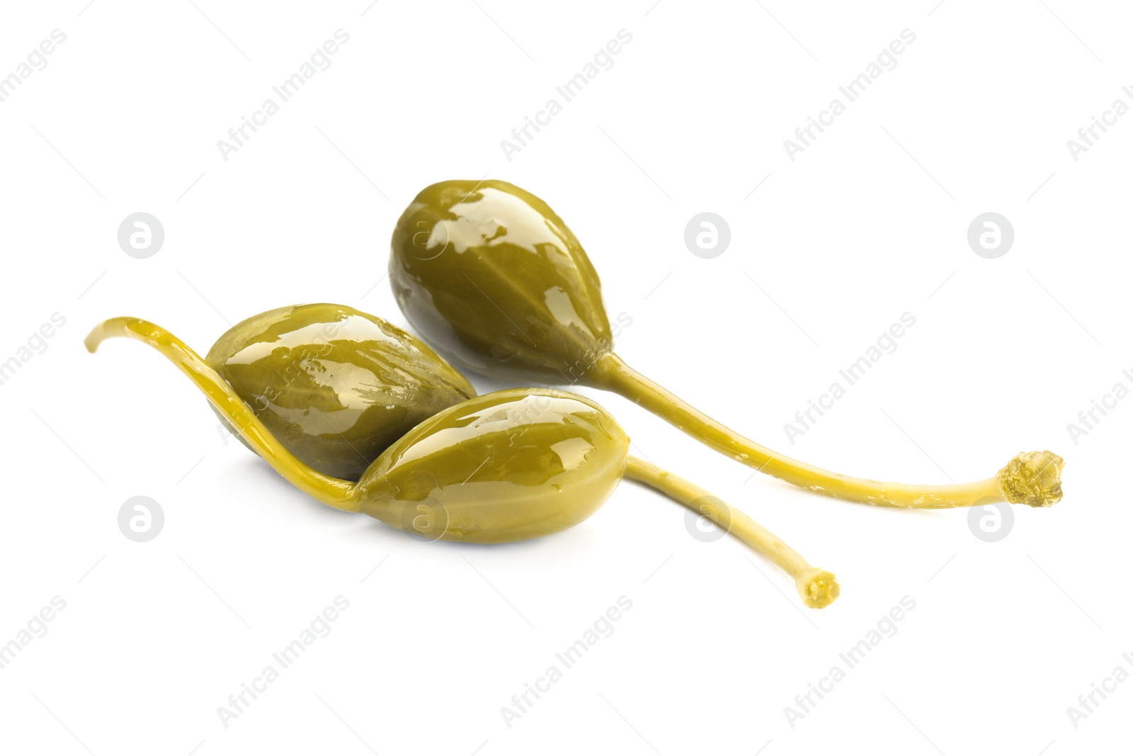 Photo of Three delicious pickled capers on white background