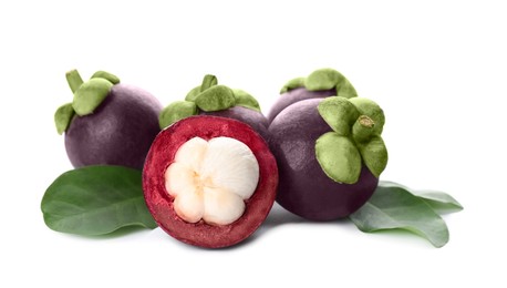 Photo of Fresh mangosteen fruits with green leaves on white background