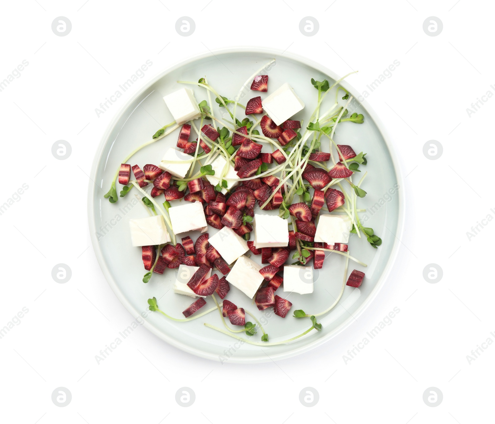 Photo of Delicious fresh carrot salad with feta cheese isolated on white, top view