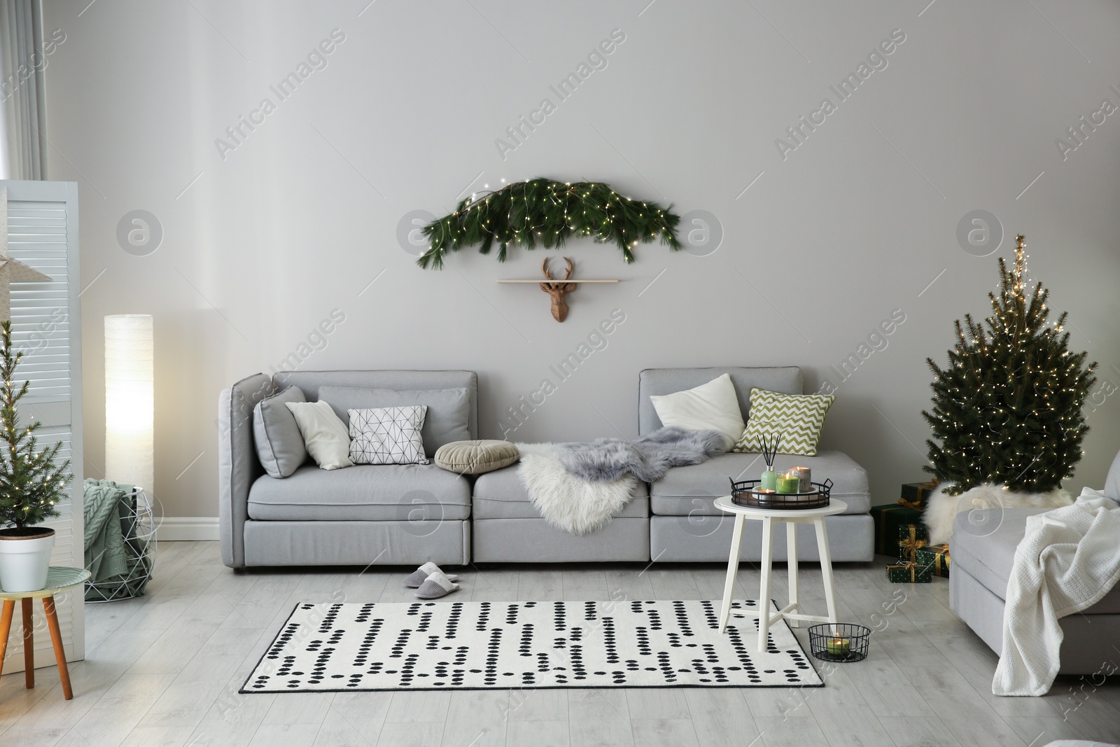 Photo of Stylish living room with Christmas decorations. Interior design
