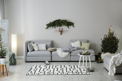 Stylish living room with Christmas decorations. Interior design